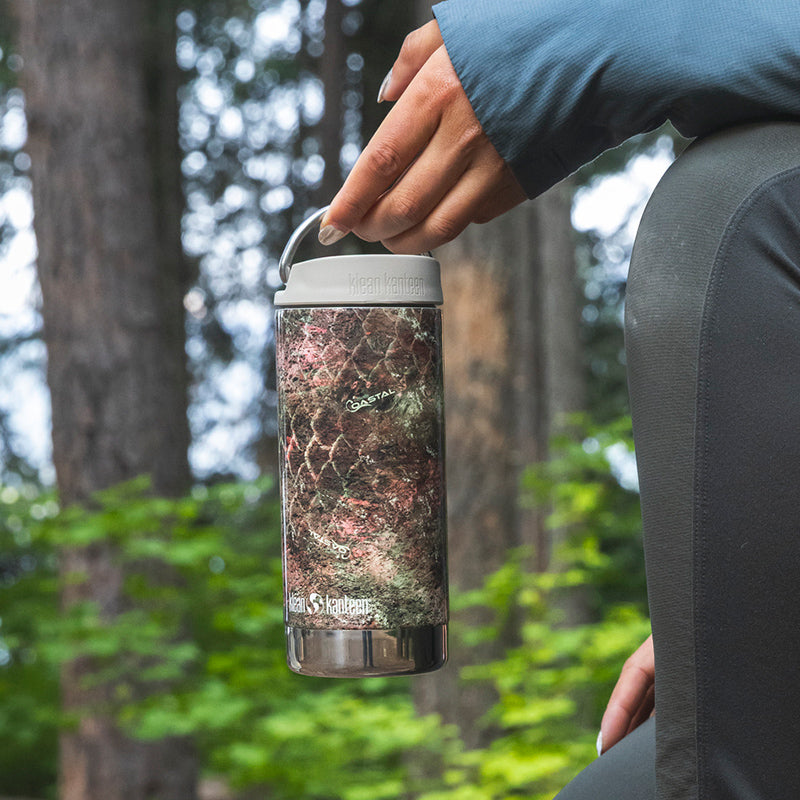 12oz-tkwide-with-twist-cap-mossy-oak-b0 12oz_tumbler_mossyoak_rainbowtrout_hand_closeup_square.jpg