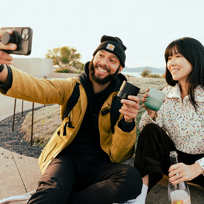 bring-your-own-party-kit-tumblers-and-cocktails-d6 8oz_rise_lowball_black_iceberg_couple_selfie_city_square.jpg