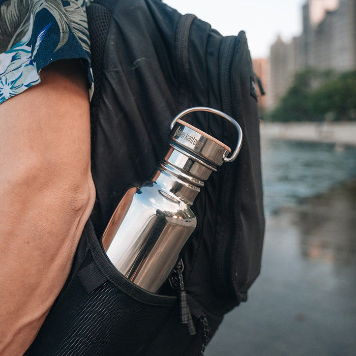 27oz-reflect-with-bamboo-cap-j9 K27SSLRF-MS-BAMBOO_reflect-bottle_backpack_lifestyle.jpg